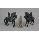 A Chinese pottery figure, 11cm high, together with a pair of Eastern bronzed metal figures on