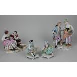 A pair of Sitzendorf porcelain figures of flower sellers 10.5cm high, together with two