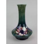 A Moorcroft pottery vase in the 'Anemone' pattern, the flared base with slender fluted neck,