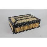 An Indian porcupine quill box, the inside of the hinged lid inlaid in bone with an elephant and