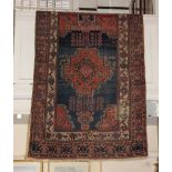 A Persian Ashfar type rug, red ground, with geometric motifs within multiple borders 200cm long by