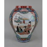 A Japanese porcelain vase blue ground with colourful birds and creatures amongst flowers and two