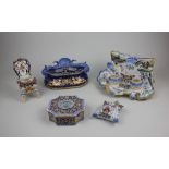 A collection of faience pottery to include a French Gien inkstand with shell and dolphin surmount,