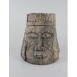 An African wooden mortar carved as a head 28cm high