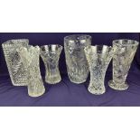 Six various cut glass vases, to include one decorated with daffodils 27.5cm high, and another with
