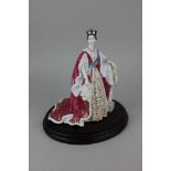 A Royal Worcester porcelain limited edition figure of Queen Victoria no. 235 of 4,500 21.5cm high,
