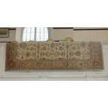A Zeigler wool rug made in Pakistan, cream ground with repeat pattern within a border 253cm by