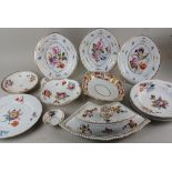A collection of 19th century porcelain dishes decorated with flowers and gilt embellishments, to