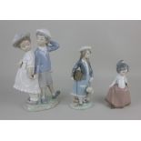 A Lladro porcelain figure group of a pair of children, 26cm high, a Lladro figure of a schoolgirl