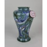 A Cobridge stoneware 'Ocean Travellers' vase decorated with dolphins on blue ground 26.5cm high