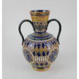 A Doulton Lambeth two handled vase, of bulbous form with tapering cylindrical neck, with beaded