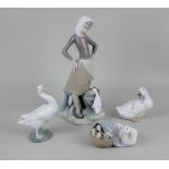 Three Lladro porcelain figures comprising a milkmaid beside a white duck 24cm high, a white duck
