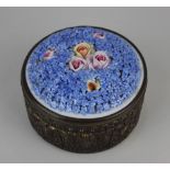 A gilt metal mounted porcelain pot and cover, the lid encrusted with forget-me-nots and roses 13cm
