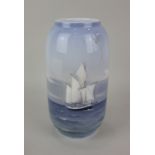 A Royal Copenhagen porcelain vase decorated with a sailing boat 21cm high