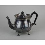 An Edward VII silver teapot circular shape with shaped rim and spiral fluting on four shell cast