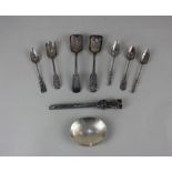 A pair of Chinese silver spoons with shovel shaped engraved bowls and foliate cast handles and
