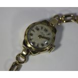 A lady's 9ct gold and yellow metal bracelet watch gross weight 14g