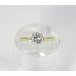 An 18ct gold and platinum solitaire diamond ring, eight claw set with an old European cut diamond