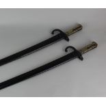 Two French sword bayonets one stamped P 39581, the other stamped C 74147