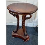 A mahogany occasional table the circular top with three metal mounted supports in the form of swan