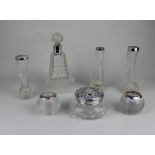 A collection of seven silver mounted glass items to include a Victorian scent bottle with silver