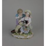 A Meissen porcelain figure group of a girl and boy with a lamb inscribed '812' to base 13cm high (