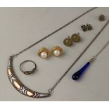 A small collection of silver and costume jewellery to include a pair of Monet earrings and a