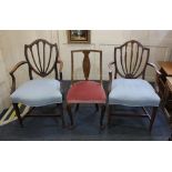 Two similar carver dining chairs with shield shaped back and pierced splats, overstuffed seats in