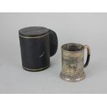 A cased Victorian silver christening mug with engraved decoration and presentation inscription,