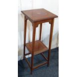 An Edwardian mahogany inlaid jardiniere stand with square top and under shelf on slender square