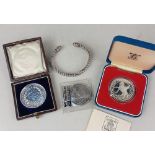 A white metal torque bracelet, together with a Kingswood School Hunting Medal, presented, an