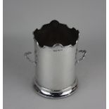 A George V silver two-handled bottle coaster tall cylindrical form with scalloped rim on turned