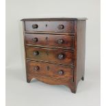 A Georgian mahogany miniature chest of drawers possibly an apprentice piece, with moulded edge top