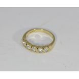 A five stone diamond ring, in bezel setting, in 18ct yellow gold