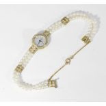 GMT, a lady's pearl and diamond bracelet watch with round brilliant cut diamond set case on a