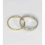 An 18ct white gold band, and an 18ct yellow gold band gross weight 4g