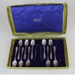 A set of ten George V silver teaspoons and a pair of matching sugar tongs Sheffield 1916, 5oz