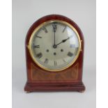 An Edwardian mahogany mantle clock with domed case, large circular dial with Roman numerals, the