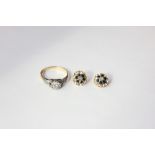 A diamond single stone ring claw set and with tiny shoulder stones in platinum on 18ct gold,