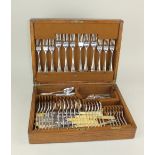 A Mappin & Webb oak canteen of silver plated Old English pattern cutlery with rattail bowls, setting