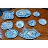 A collection of nine various blue and white transfer printed dishes and saucers including Spode