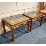 A pair of Chinoiserie glass topped side tables 69cm