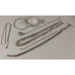 A collection of silver and white metal jewellery to include bangles, bracelets and necklaces