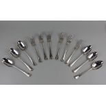 A set of six George V silver Old English pattern dessert spoons with rattail bowls and a matching