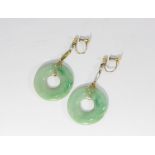 A pair of jade disc drop earrings set in yellow metal with screw fittings