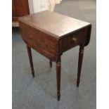 A 19th century mahogany work table with two drop flaps above a drawer, on turned legs 74cm fully