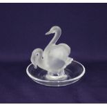 A Lalique glass pin dish surmounted by two swans, with engraved signature to base 10cm high