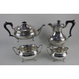 A George V silver four piece tea and coffee set comprising of teapot, coffee pot, sugar bowl and