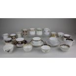 A collection of 18th century and later porcelain tea cups and saucers, tea bowls and coffee cans, to