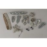 A collection of costume jewellery brooches, earrings etc to include some paste set (a/f)